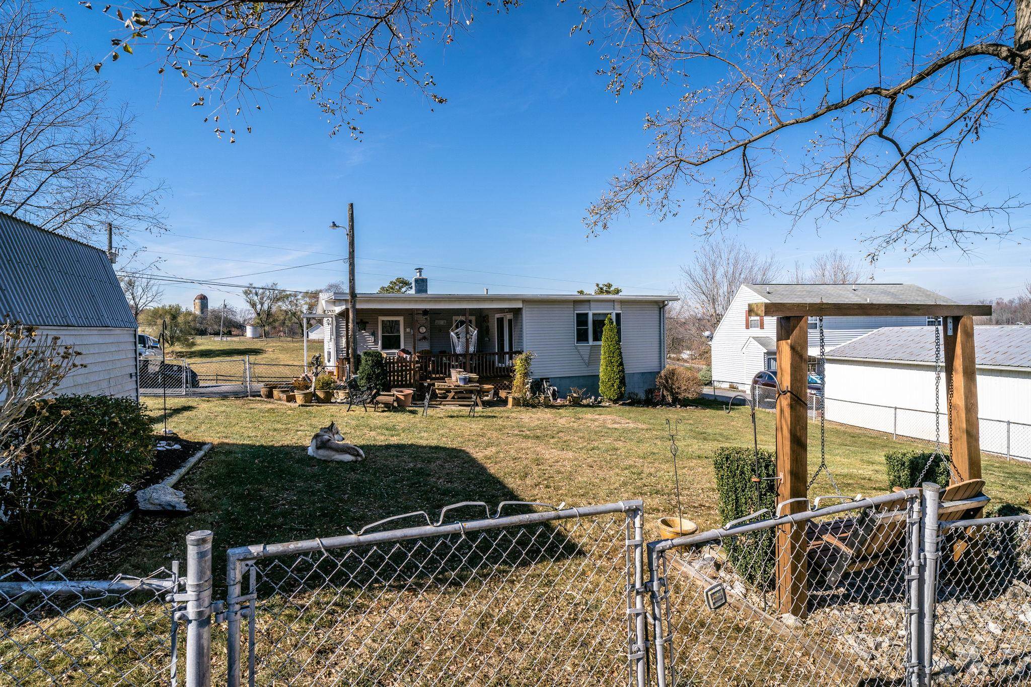 3154 Layman Trestle Road Harrisonburg, VA 22802 - Photo 30 of 30 a view of a patio with table and chairs potted plants