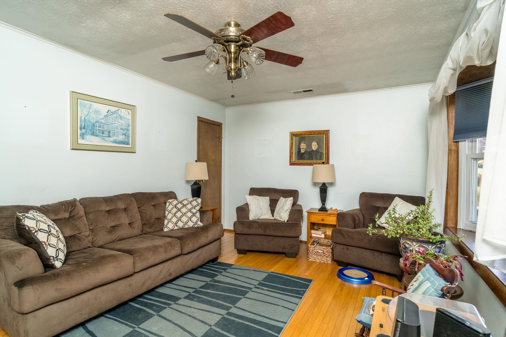 3154 Layman Trestle Road Harrisonburg, VA 22802 - Photo 7 of 30 a living room with furniture and a couch