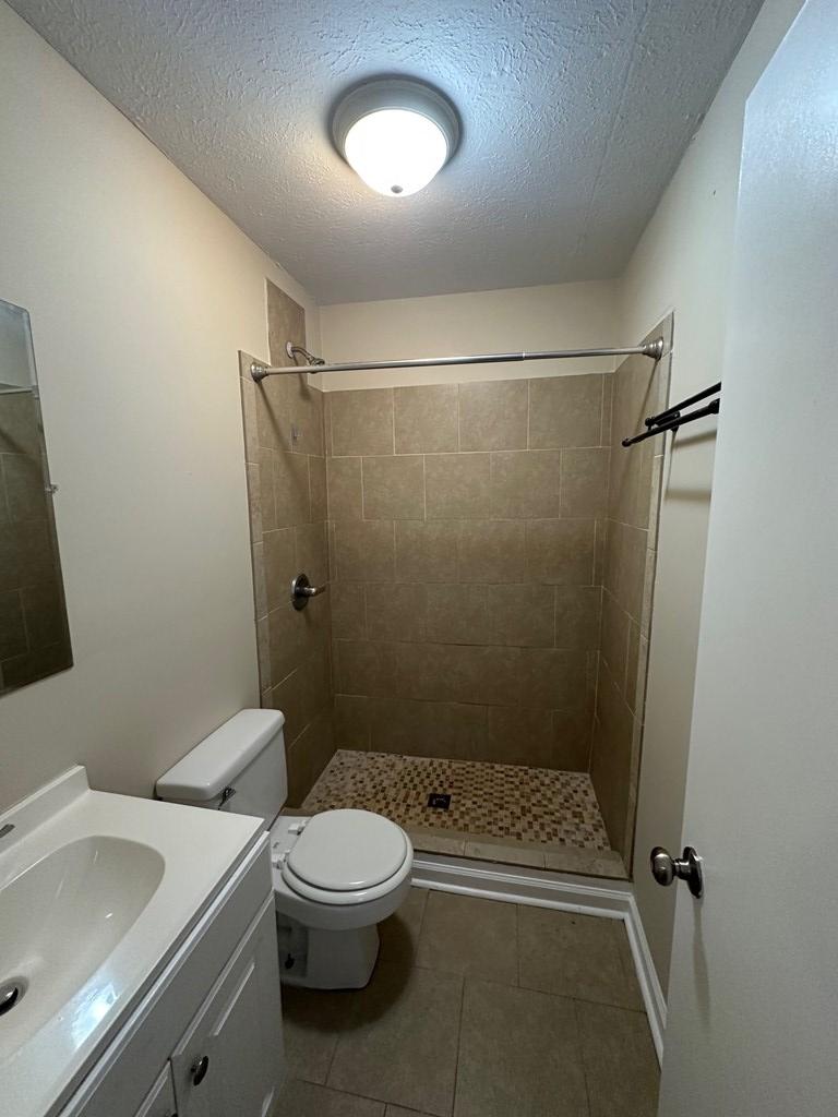 4135 Forrest Road Columbus, GA 31907 - Photo 12 of 15 a bathroom with a sink a toilet and shower