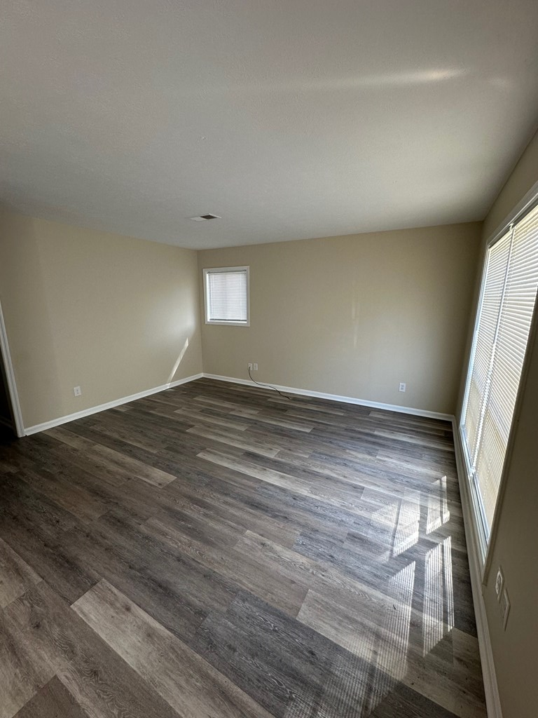 4135 Forrest Road Columbus, GA 31907 - Photo 2 of 15 wooden floor in an empty room with a window