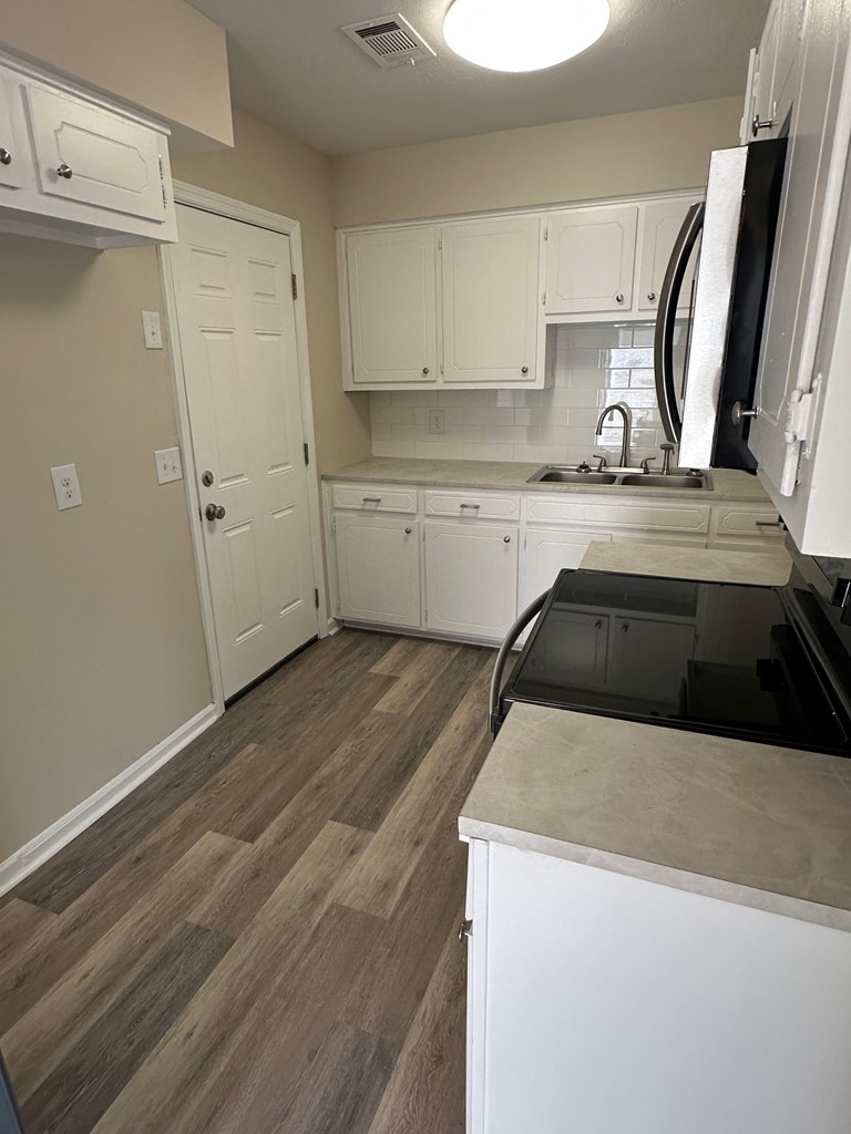 4135 Forrest Road Columbus, GA 31907 - Photo 5 of 15 a kitchen that has a sink and a stove