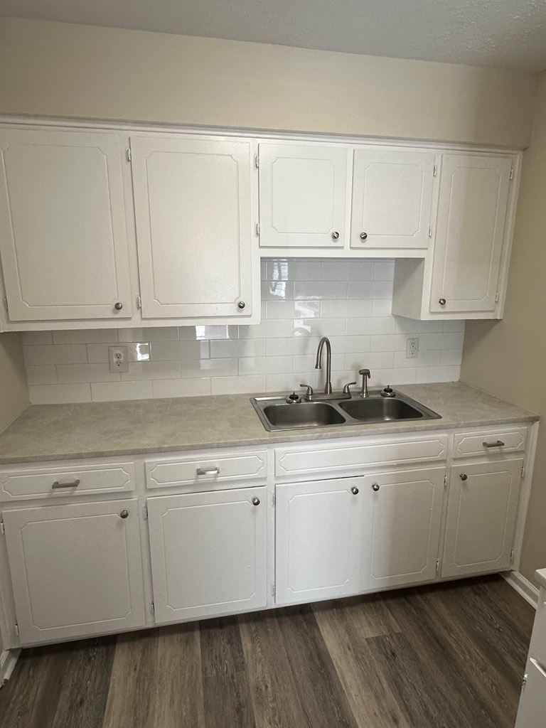 4135 Forrest Road Columbus, GA 31907 - Photo 7 of 15 a kitchen with granite countertop white cabinets and a sink