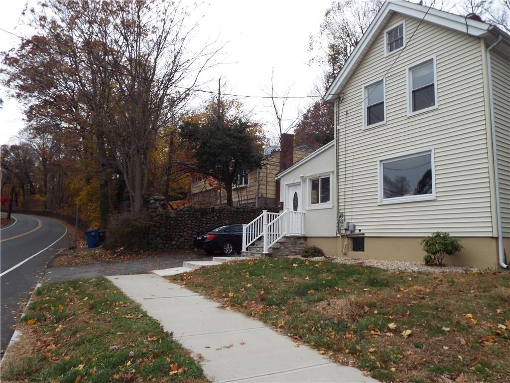 1196 Forest Road New Haven, CT 06515 - Photo 1 of 1 a view of a white house with a yard