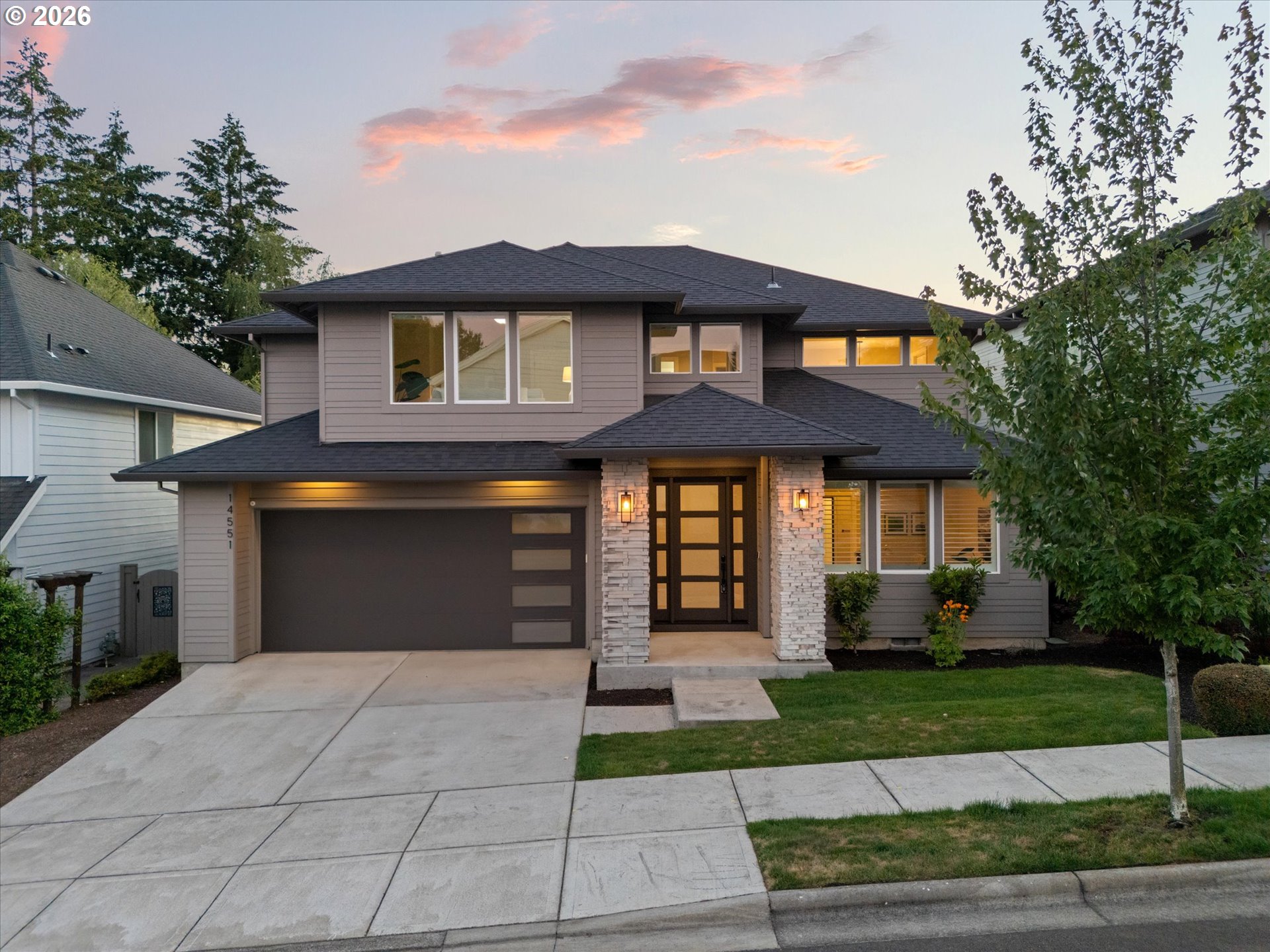 14551 Southwest 153rd Avenue Portland, OR 97224 - Photo 41 of 45 a front view of a house with a yard and garage