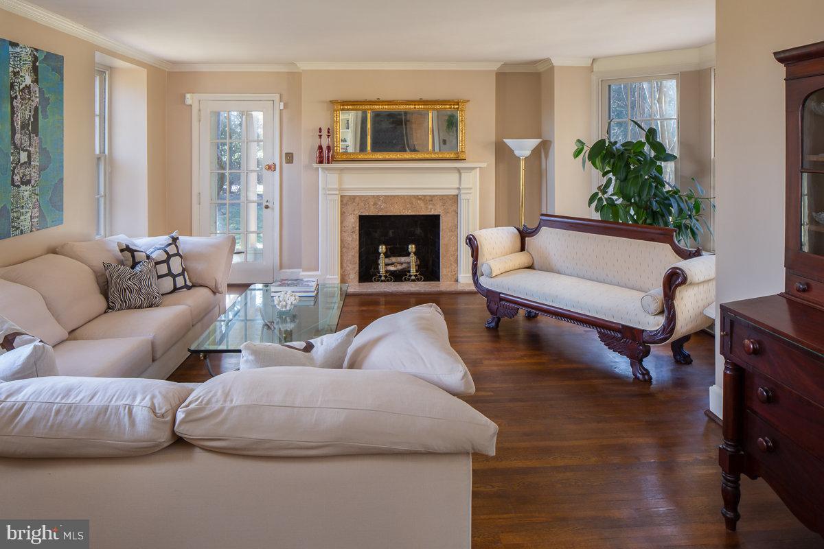 218 Fairview Road Narberth, PA 19072 - Photo 3 of 31 Living Room with Fireplace and Exit to Porch