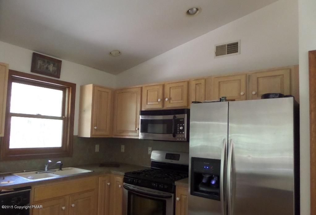 280 Pin Oak Road Stroudsburg, PA 18360 - Photo 14 of 14 a kitchen with a refrigerator and a sink