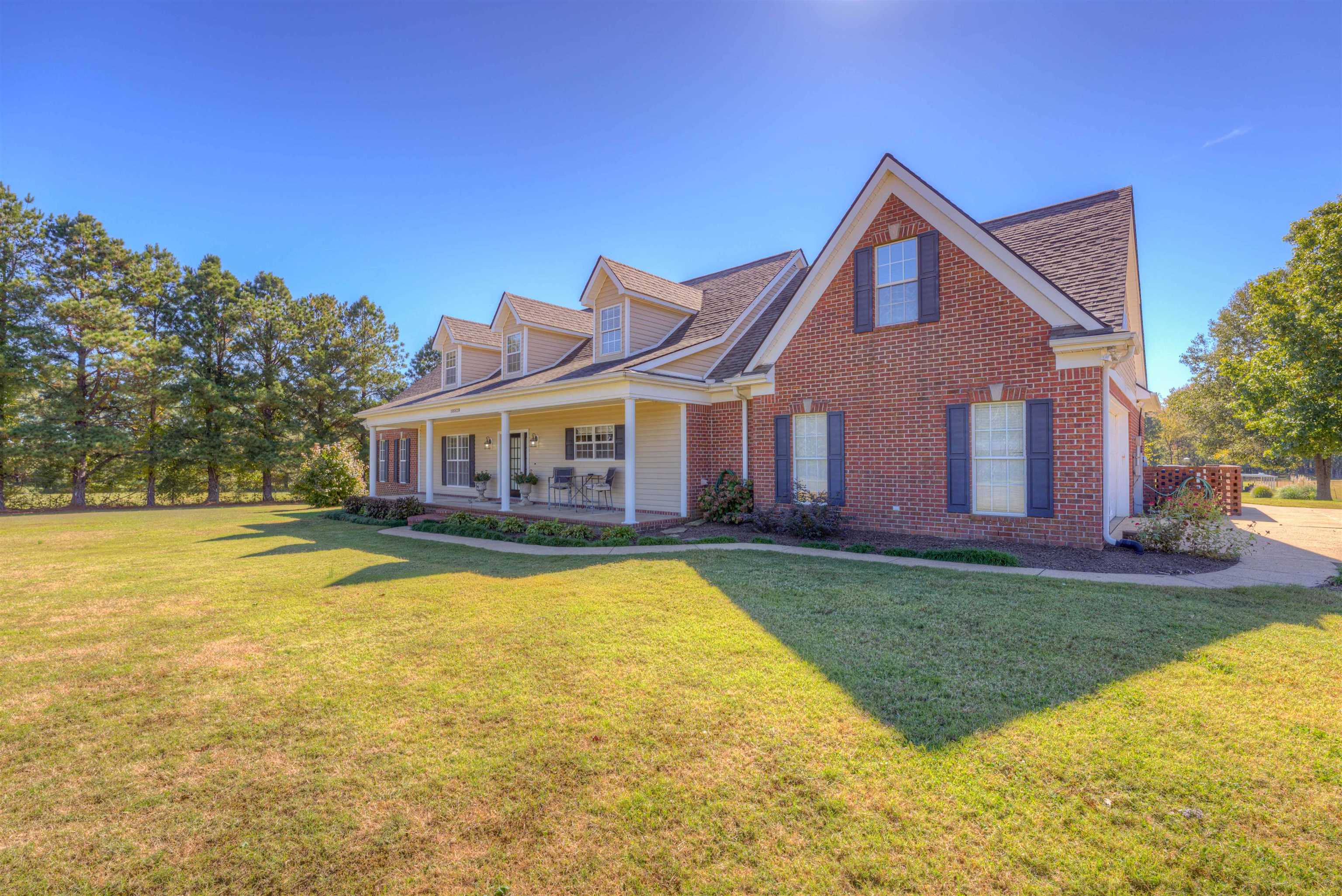 10529 Moose Road Millington, TN 38053 - Photo 15 of 40 a front view of a house with swimming pool having outdoor seating