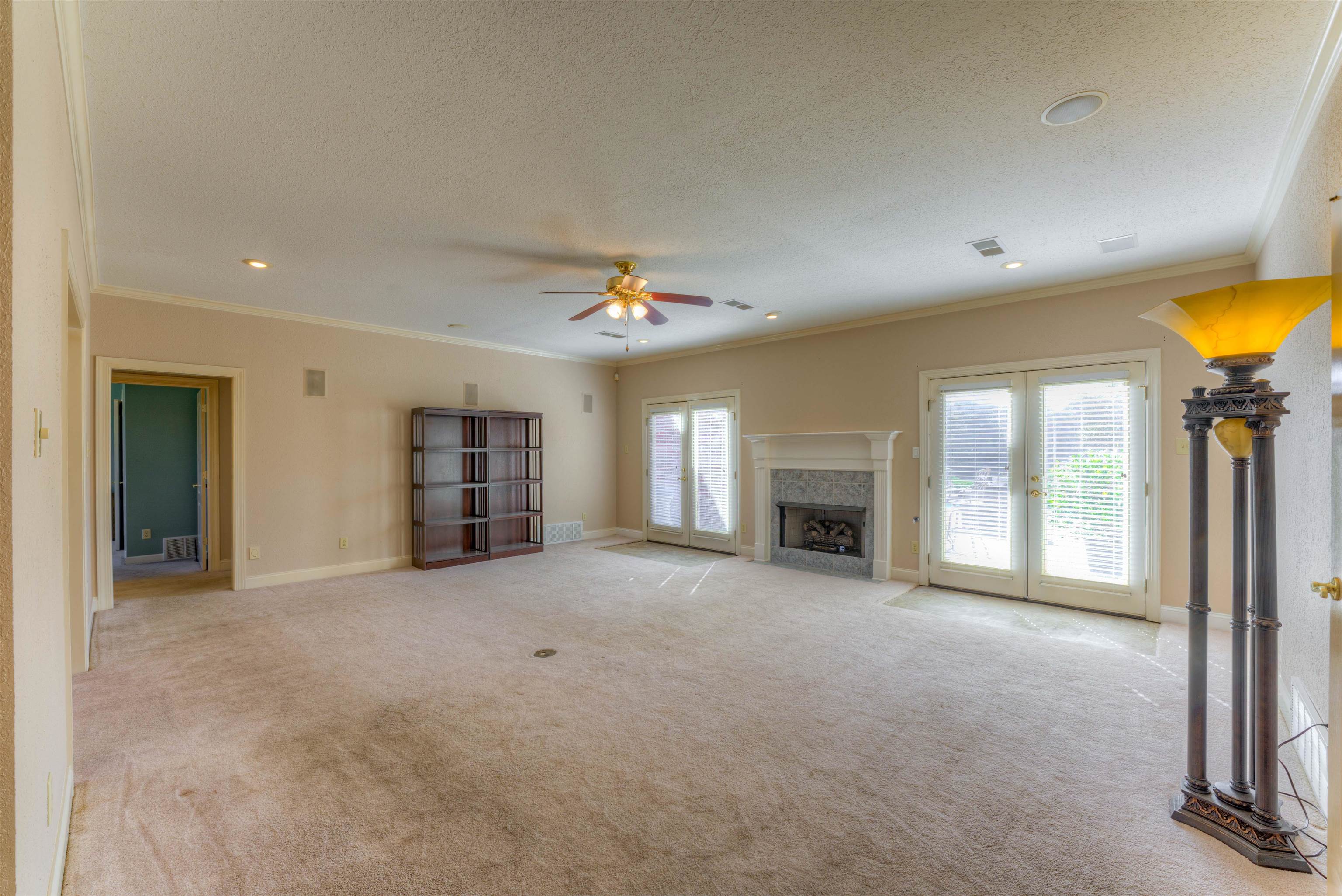 10529 Moose Road Millington, TN 38053 - Photo 24 of 40 an empty room with windows and fireplace