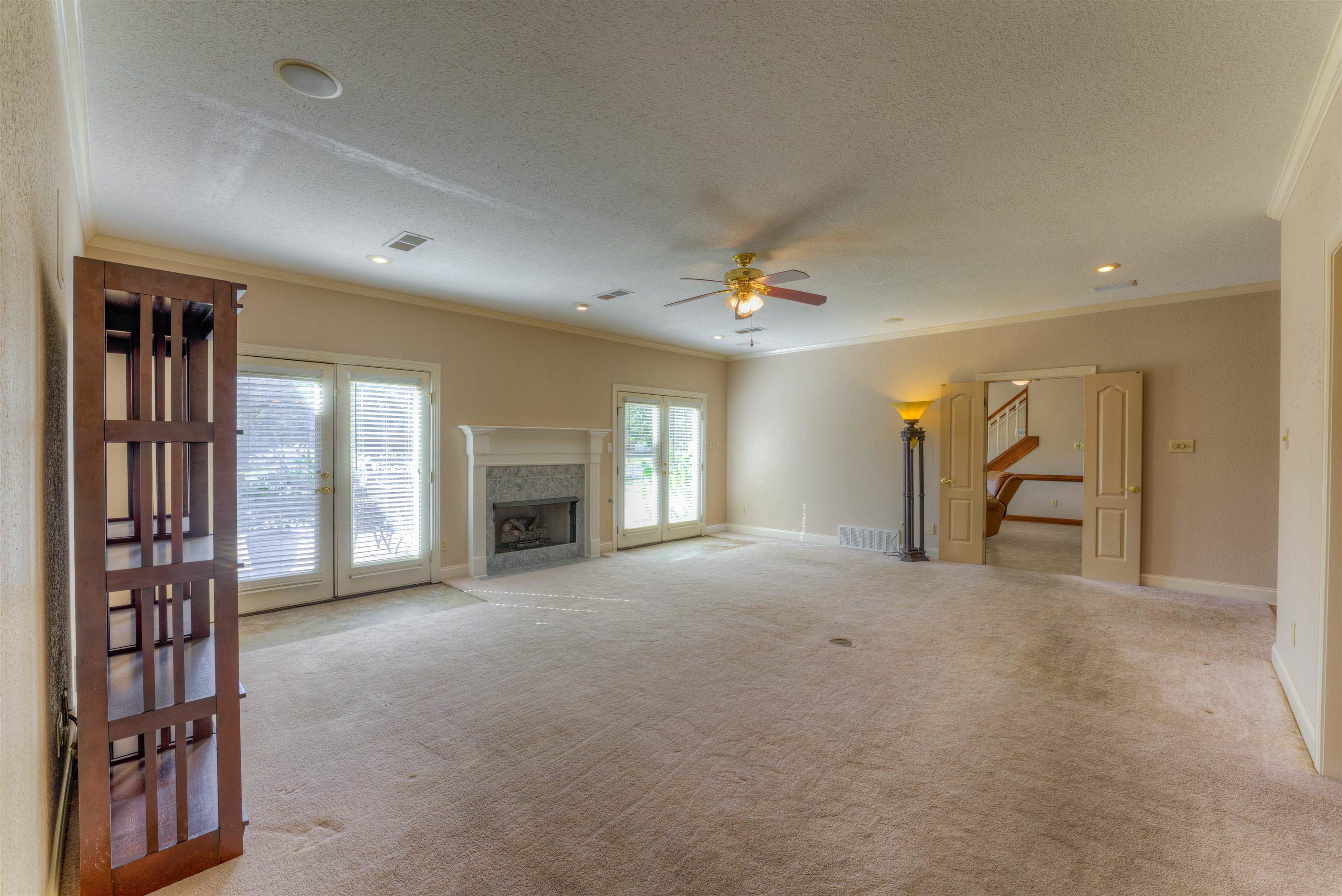 10529 Moose Road Millington, TN 38053 - Photo 25 of 40 a view of empty room with fireplace and fan