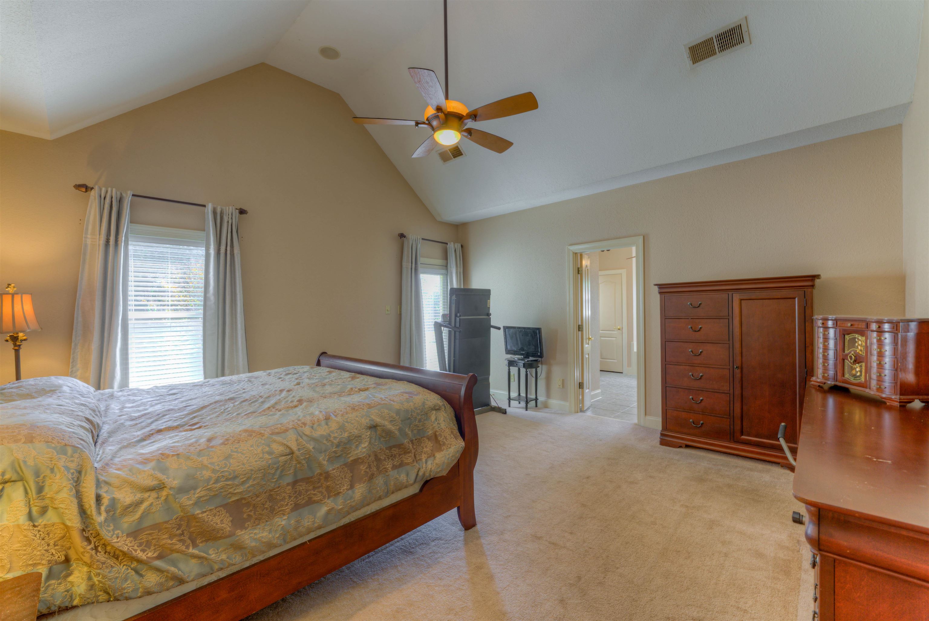 10529 Moose Road Millington, TN 38053 - Photo 28 of 40 a bedroom with a bed and a chandelier