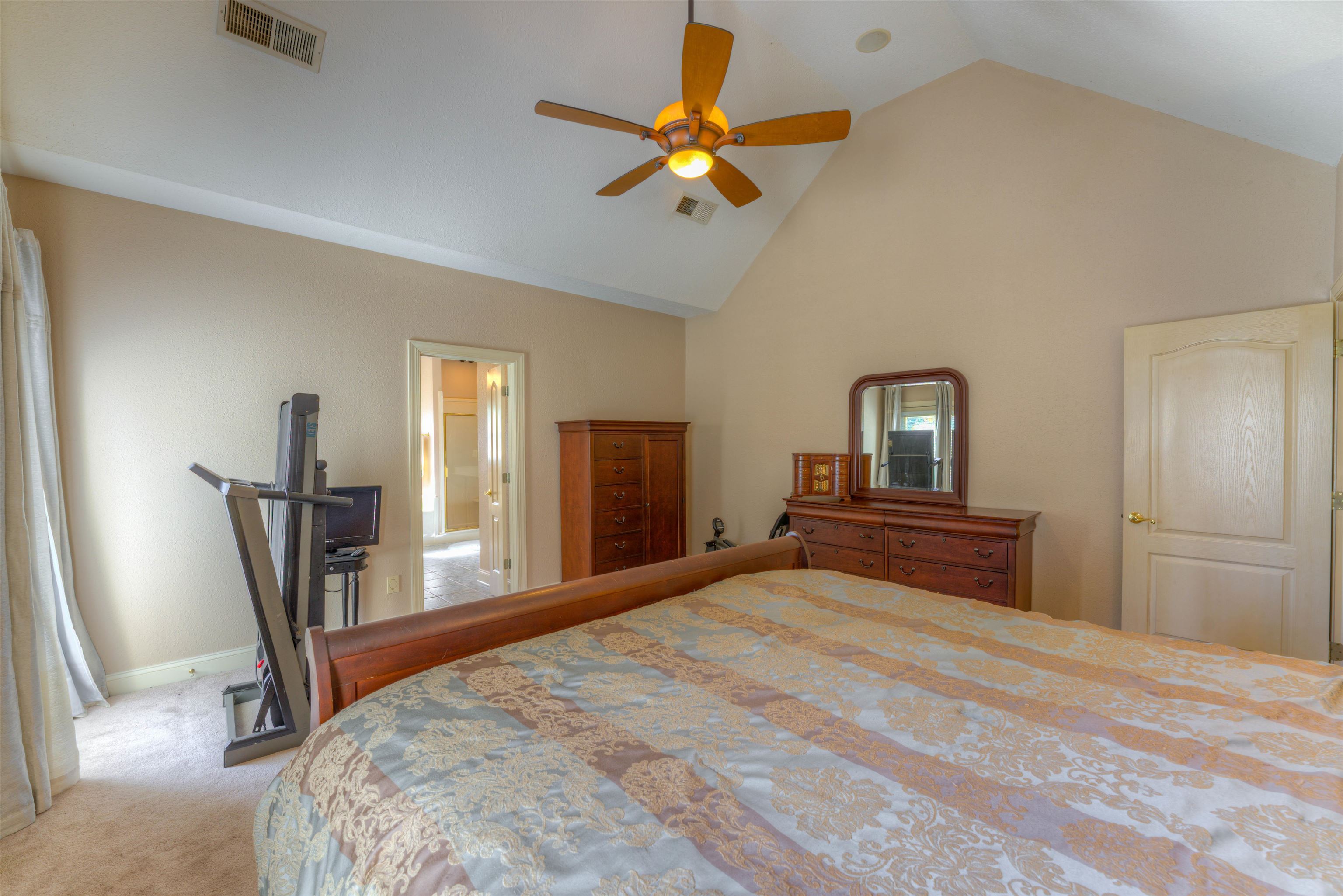 10529 Moose Road Millington, TN 38053 - Photo 29 of 40 a bedroom with a bed and a chandelier