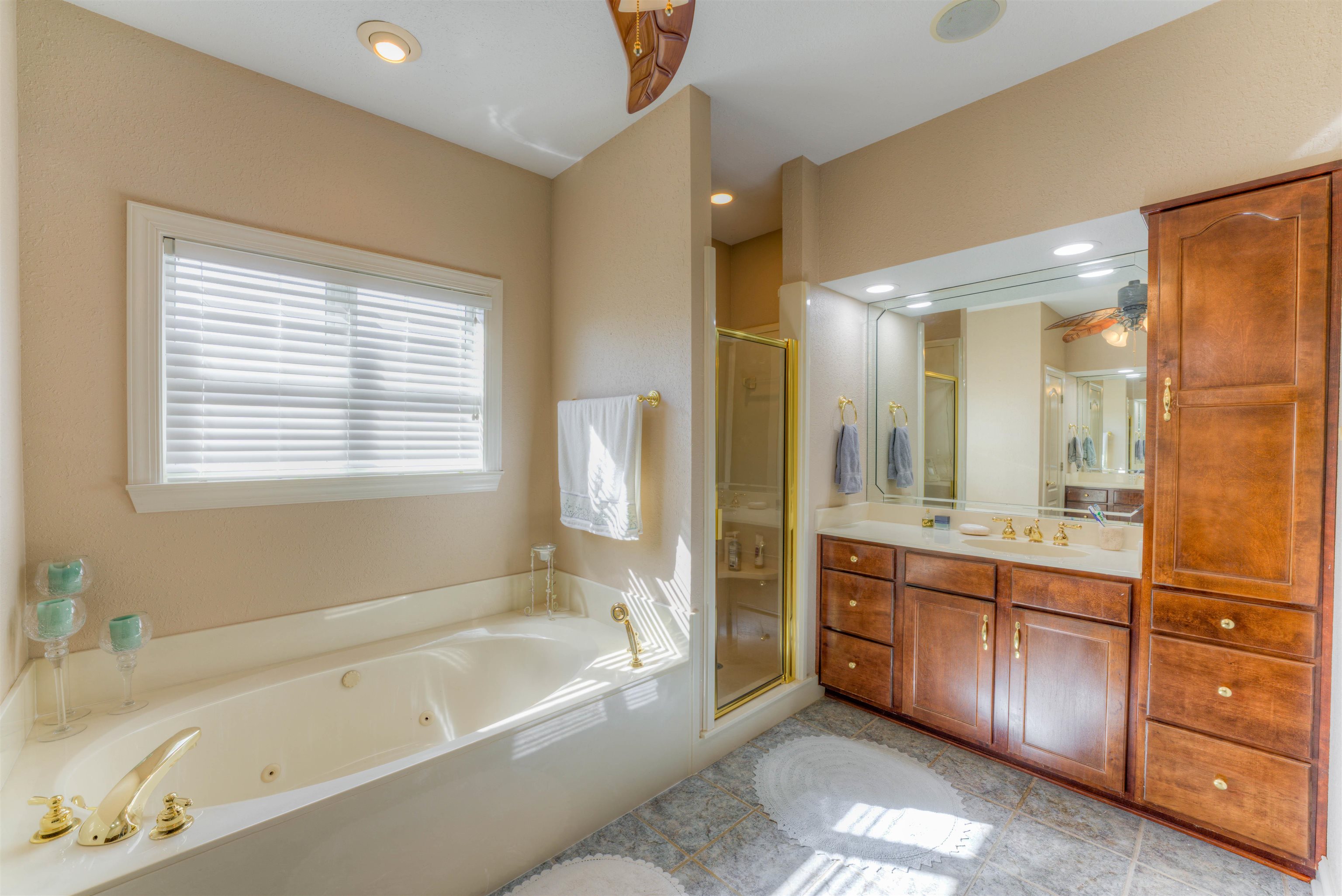 10529 Moose Road Millington, TN 38053 - Photo 32 of 40 a bathroom with a tub sink shower and mirror