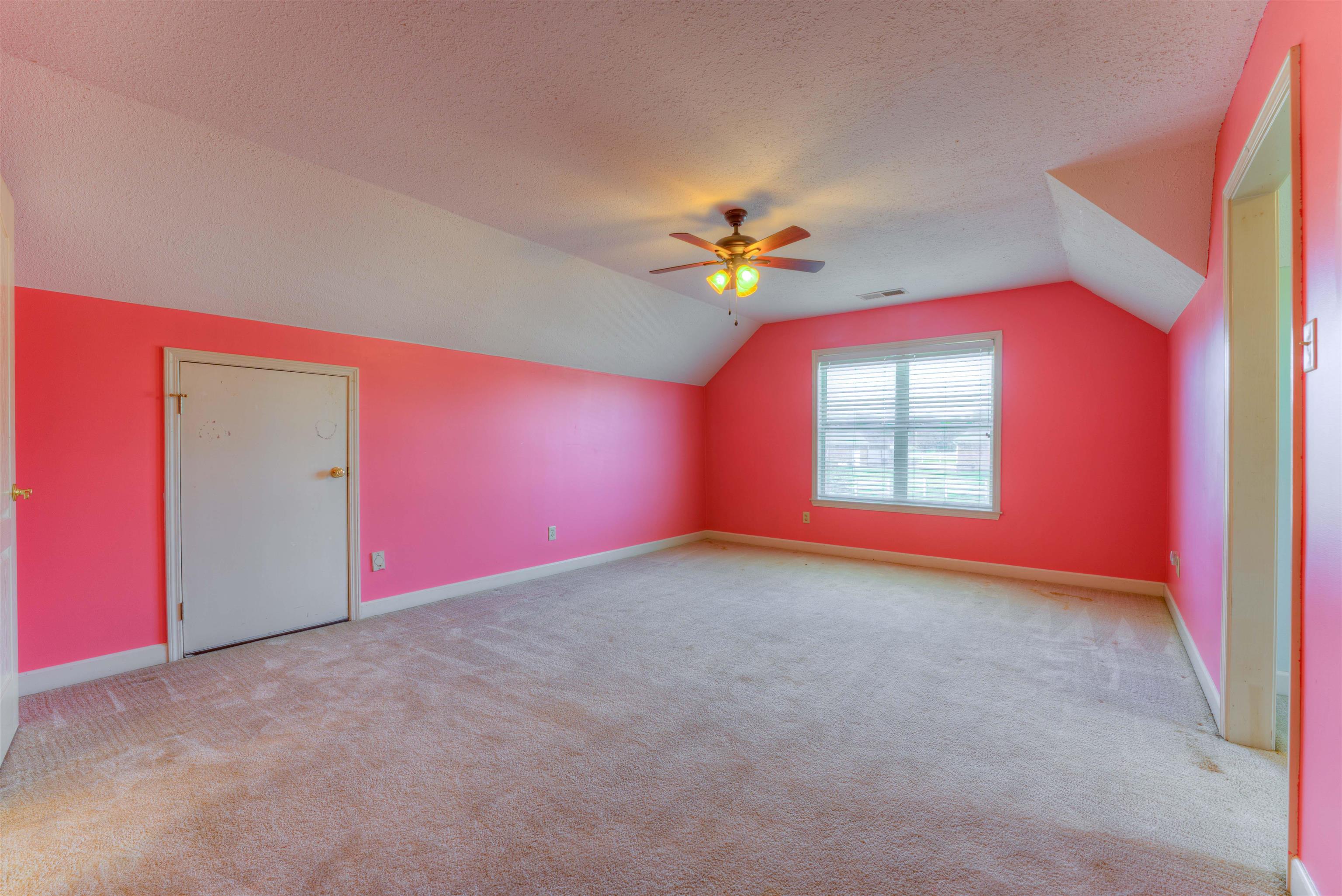 10529 Moose Road Millington, TN 38053 - Photo 39 of 40 an empty room with a window and a chandelier
