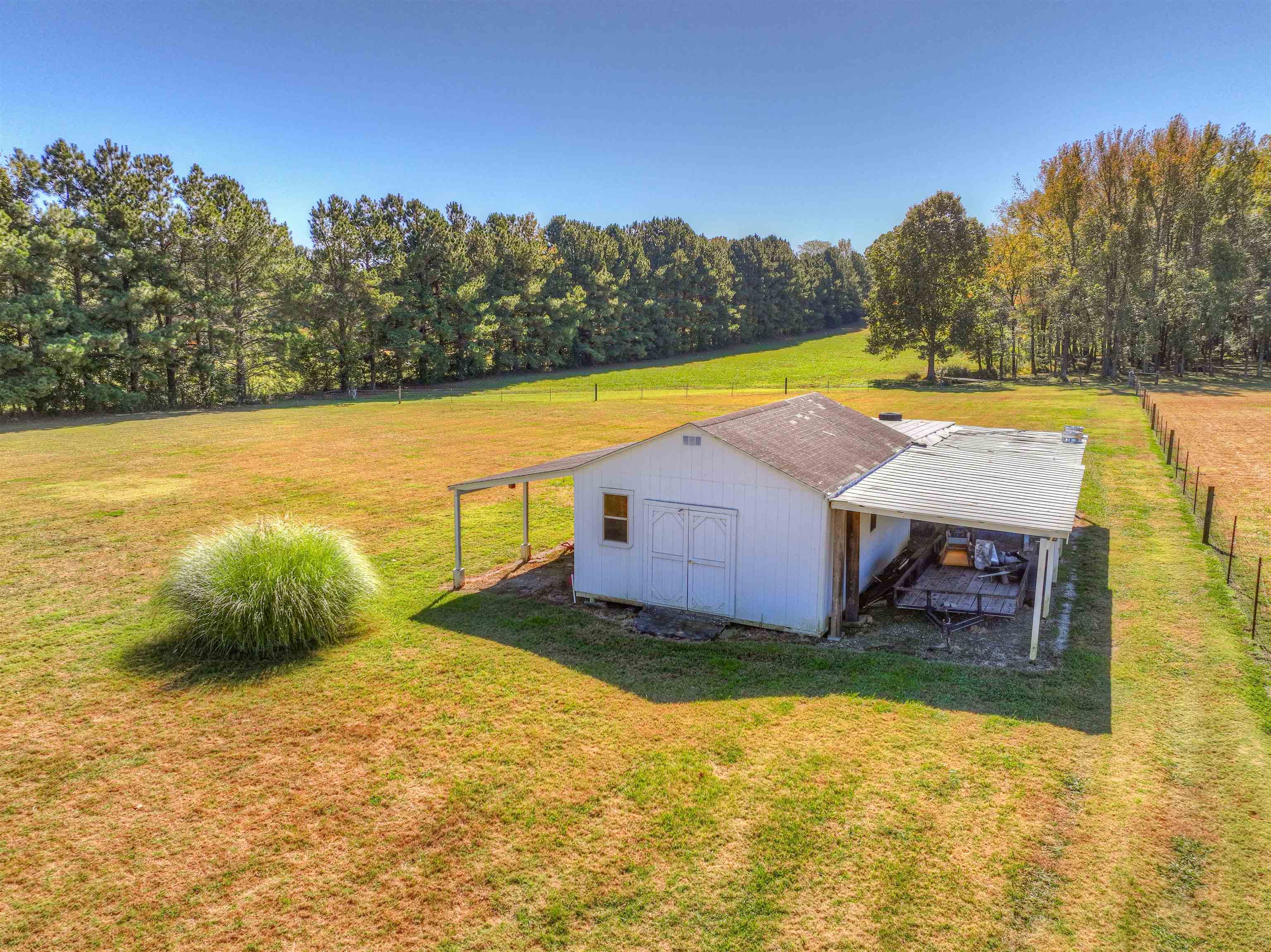 10529 Moose Road Millington, TN 38053 - Photo 9 of 40 a view of a swimming pool and trees in the background