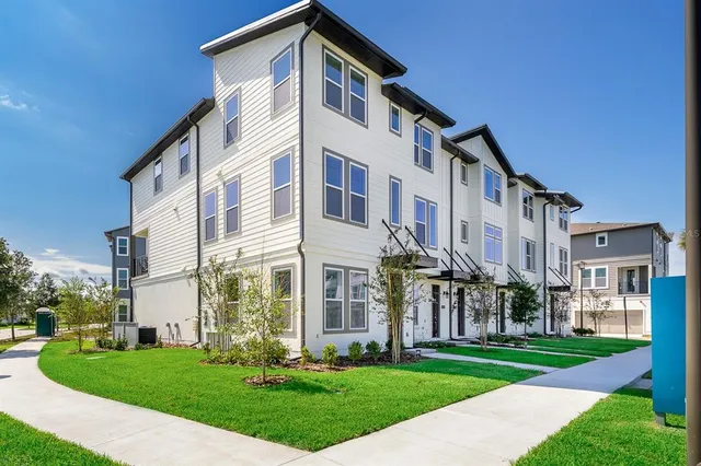 a front view of a building with a yard