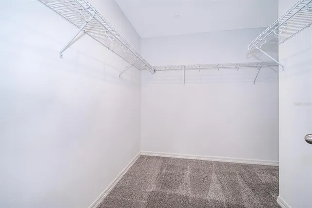 a view of a room with shelf of the wall