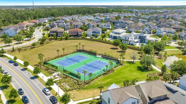 an aerial view of residential houses with outdoor space