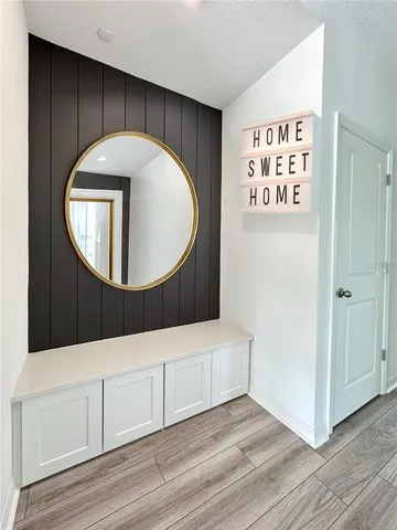 a bathroom with a sink a mirror and a shower