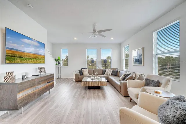 a living room with furniture and a large window