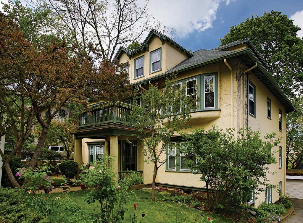 69 Winthrop Road, Unit 69 Brookline, MA 02445 - Photo 1 of 14 a front view of a house with a yard