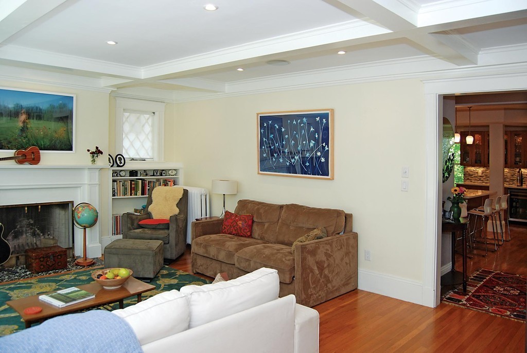 69 Winthrop Road, Unit 69 Brookline, MA 02445 - Photo 4 of 14 a living room with furniture and a fireplace