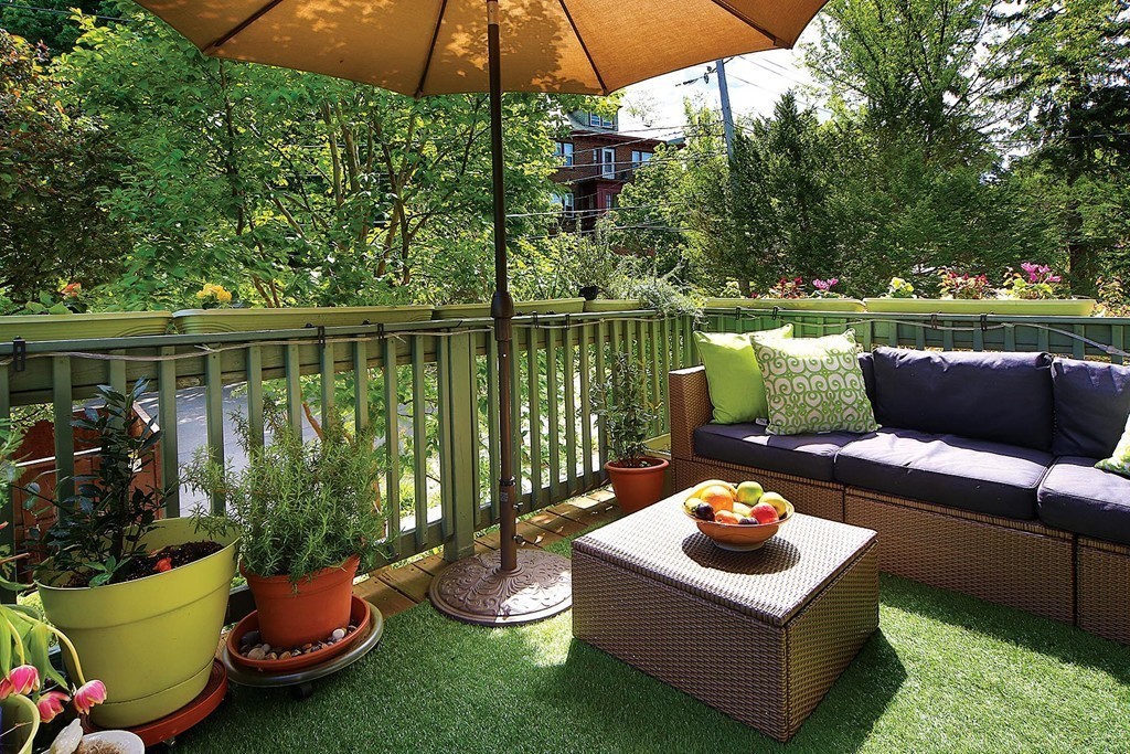 69 Winthrop Road, Unit 69 Brookline, MA 02445 - Photo 6 of 14 a view of a patio with couches chairs and a potted plant