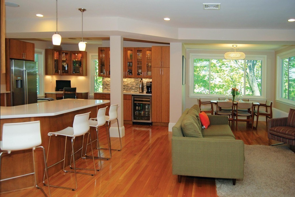 69 Winthrop Road, Unit 69 Brookline, MA 02445 - Photo 7 of 14 a living room with furniture and large windows