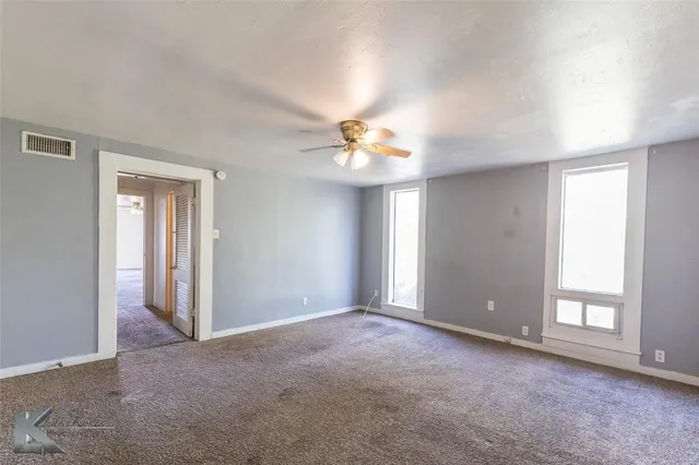 a bathroom with a sink toilet and mirror
