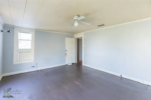 a view of an empty room and window