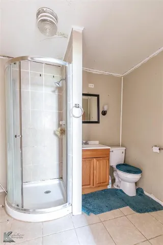 a kitchen with a refrigerator sink and cabinets