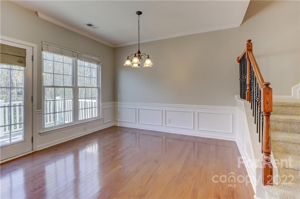562 6th Baxter Crossing Fort Mill, SC 29708 - Photo 13 of 48 a view of an empty room with wooden floor and a window