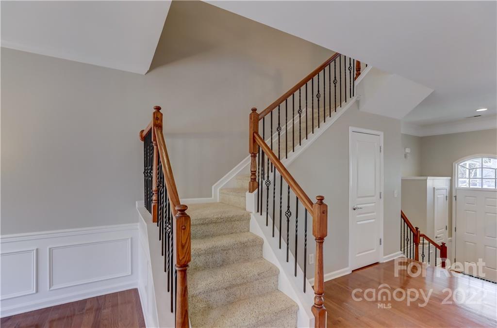 562 6th Baxter Crossing Fort Mill, SC 29708 - Photo 19 of 48 a view of entryway with wooden floor and stairs