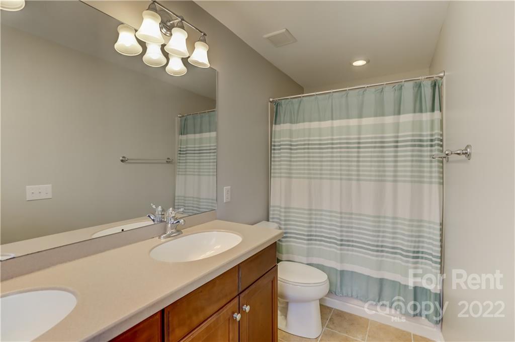 562 6th Baxter Crossing Fort Mill, SC 29708 - Photo 24 of 48 a bathroom with a sink a toilet and shower