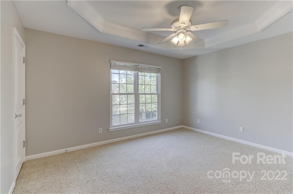 562 6th Baxter Crossing Fort Mill, SC 29708 - Photo 28 of 48 an empty room with windows and ceiling fan