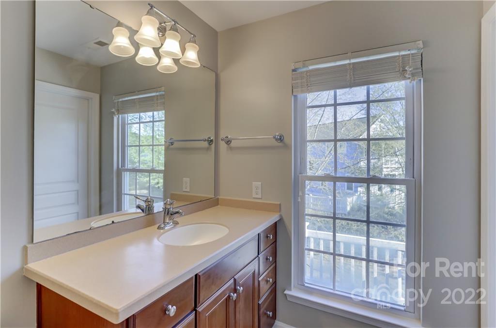 562 6th Baxter Crossing Fort Mill, SC 29708 - Photo 32 of 48 a bathroom with a sink double vanity and a mirror