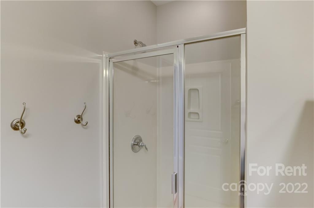 562 6th Baxter Crossing Fort Mill, SC 29708 - Photo 39 of 48 a bathroom with a glass shower door
