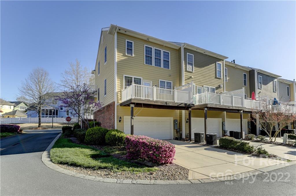 562 6th Baxter Crossing Fort Mill, SC 29708 - Photo 40 of 48 a front view of a house with garden