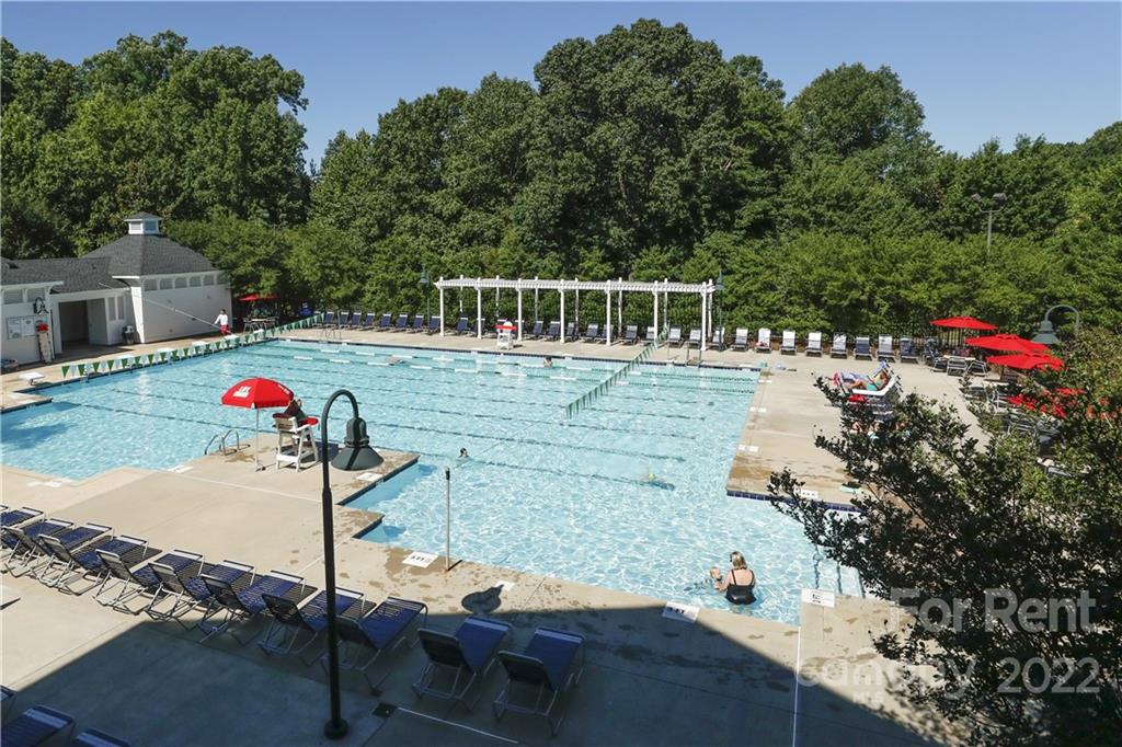562 6th Baxter Crossing Fort Mill, SC 29708 - Photo 42 of 48 a view of a wooden deck and a backyard