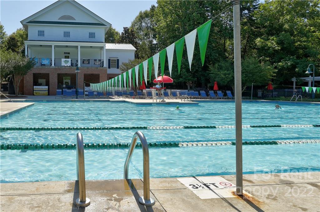 562 6th Baxter Crossing Fort Mill, SC 29708 - Photo 43 of 48 a front view of a house with garden
