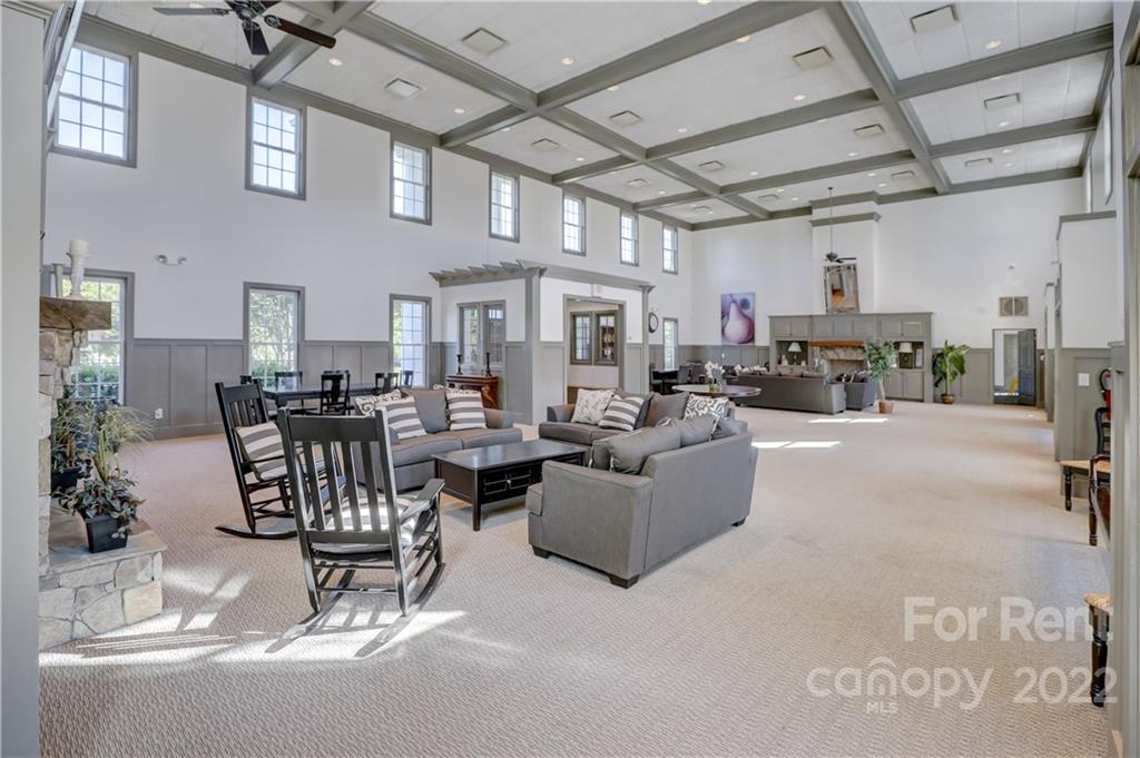 562 6th Baxter Crossing Fort Mill, SC 29708 - Photo 46 of 48 a living room with furniture and a chandelier