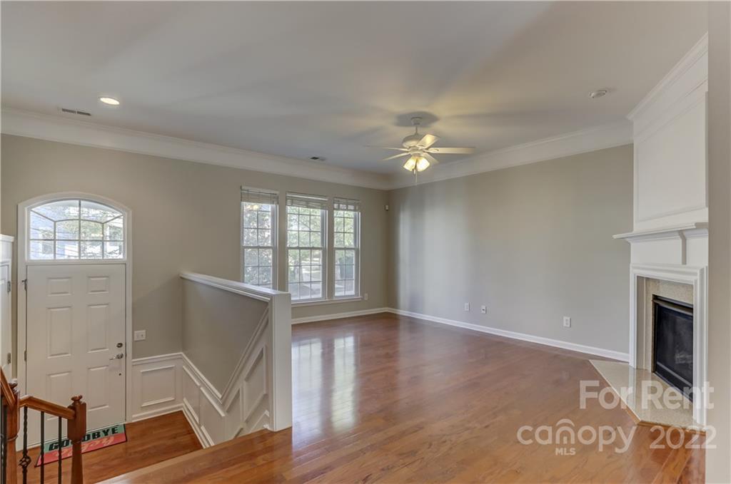 562 6th Baxter Crossing Fort Mill, SC 29708 - Photo 6 of 48 wooden floor in an empty room with a window