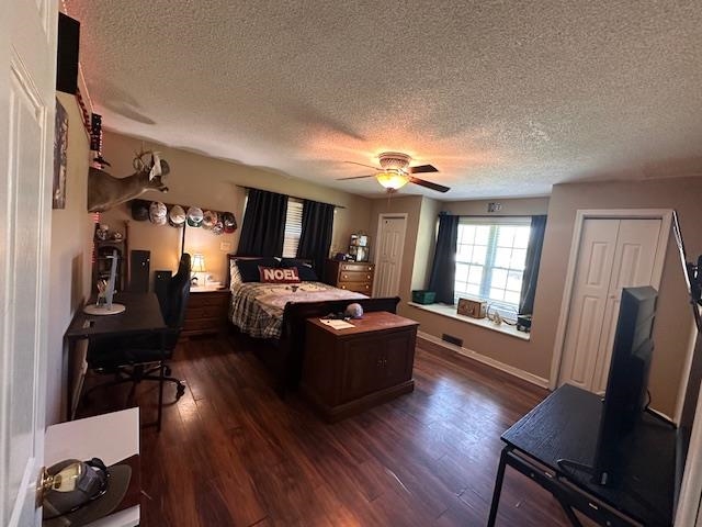 1347 Becton William Road Ripley, TN 38063 - Photo 15 of 24 Bedroom with dark wood-type flooring, a textured ceiling, and ceiling fan