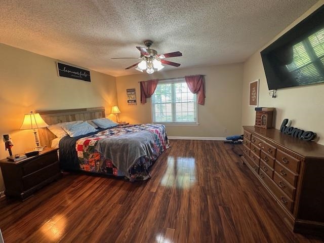 1347 Becton William Road Ripley, TN 38063 - Photo 16 of 24 Bedroom with dark wood-type flooring, a textured ceiling, and ceiling fan