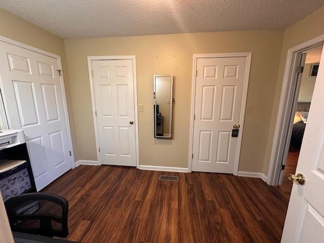 1347 Becton William Road Ripley, TN 38063 - Photo 18 of 24 Unfurnished office featuring a textured ceiling and dark wood-type flooring