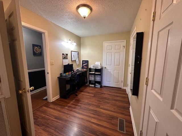 1347 Becton William Road Ripley, TN 38063 - Photo 19 of 24 Home office with dark wood finished floors and a textured ceiling