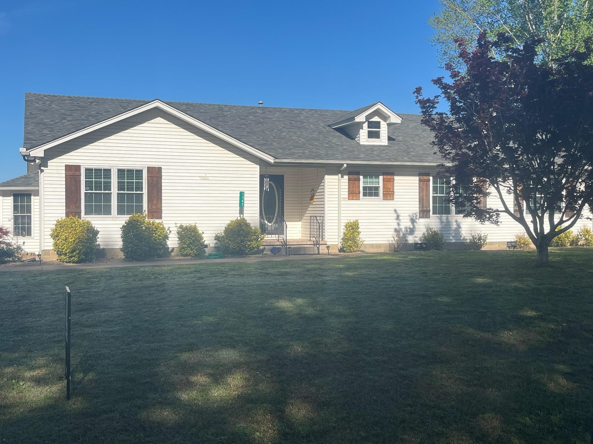 1347 Becton William Road Ripley, TN 38063 - Photo 2 of 24 View of front of home featuring roof with shingles and a front lawn