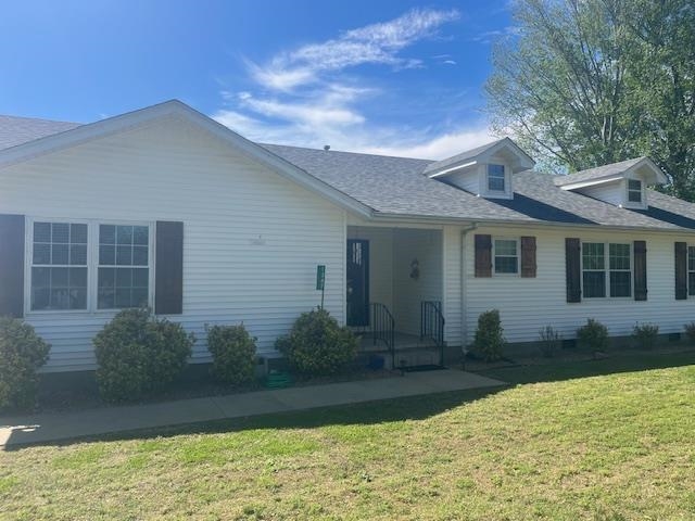 1347 Becton William Road Ripley, TN 38063 - Photo 4 of 24 View of front facade featuring a front lawn and a shingled roof