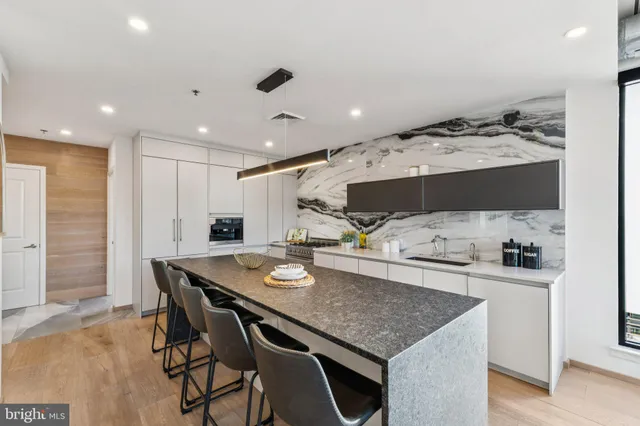 a kitchen with a table and chairs in it