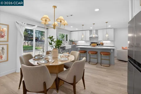 a view of a dining room with furniture window and outside view