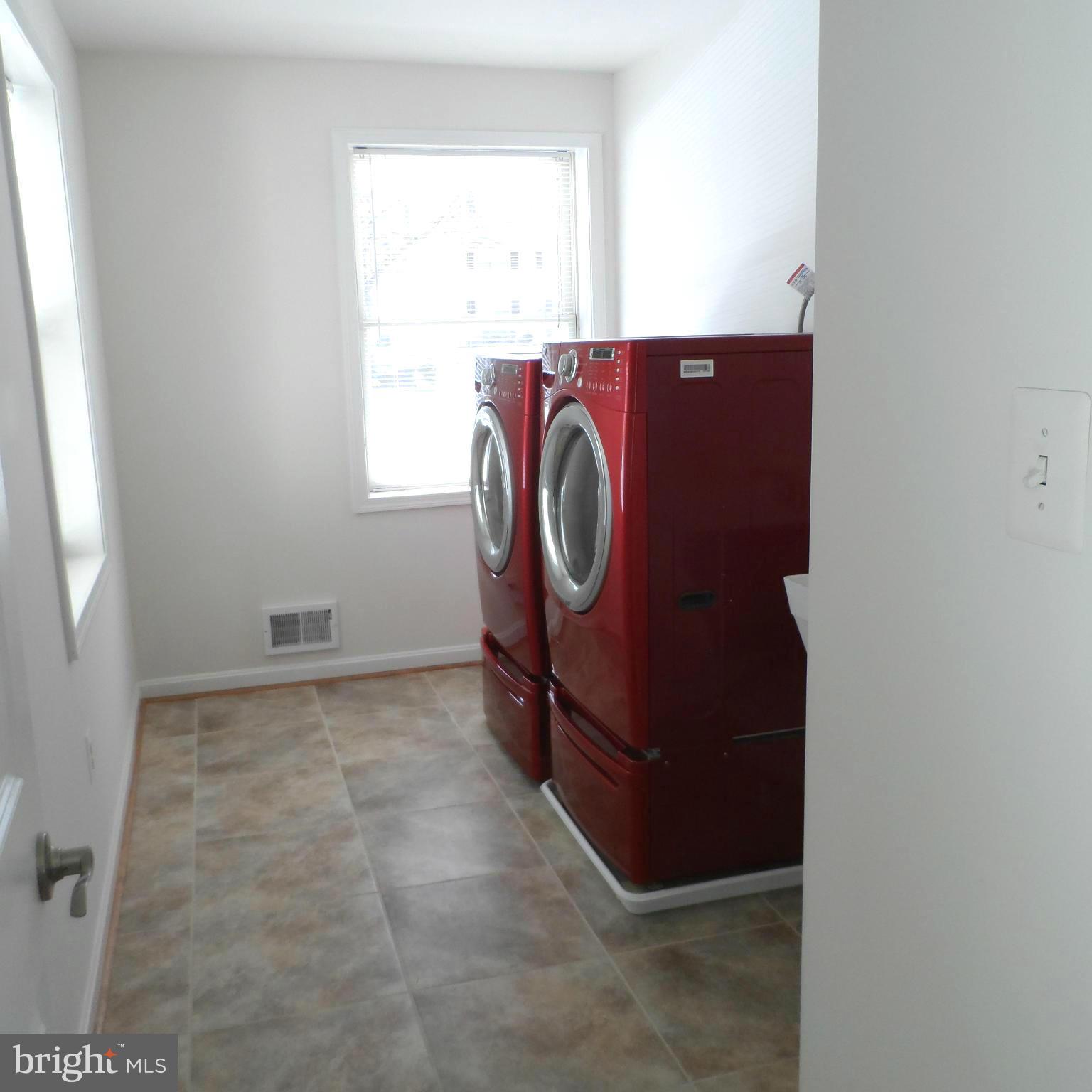 6607 Huntsman Boulevard Springfield, VA 22152 - Photo 11 of 30 Laundry Room Off Kitchen